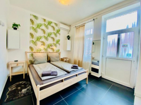 Modern Studio with City Skyline View - Green Skyline